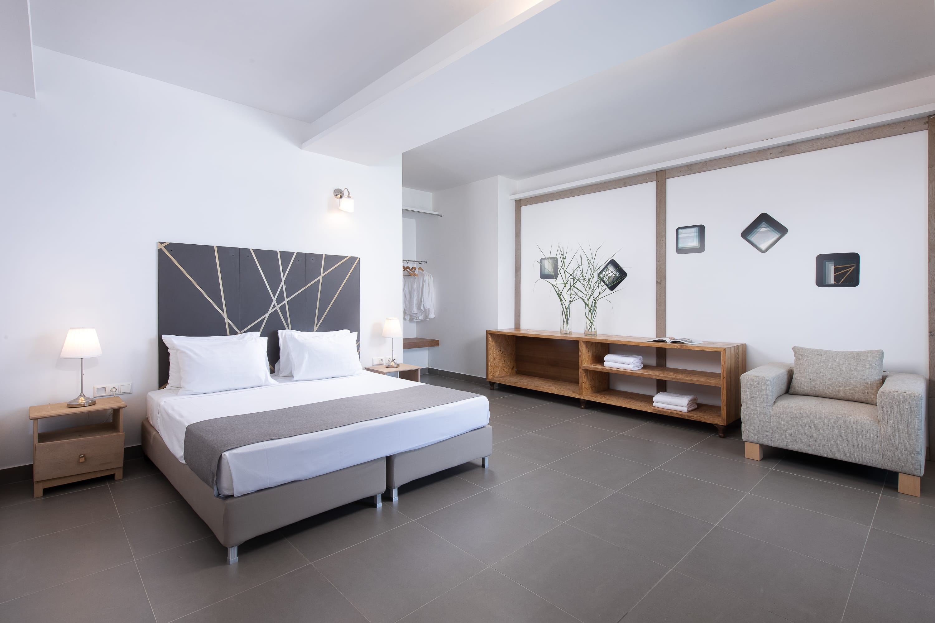 a bedroom with a bed and a desk