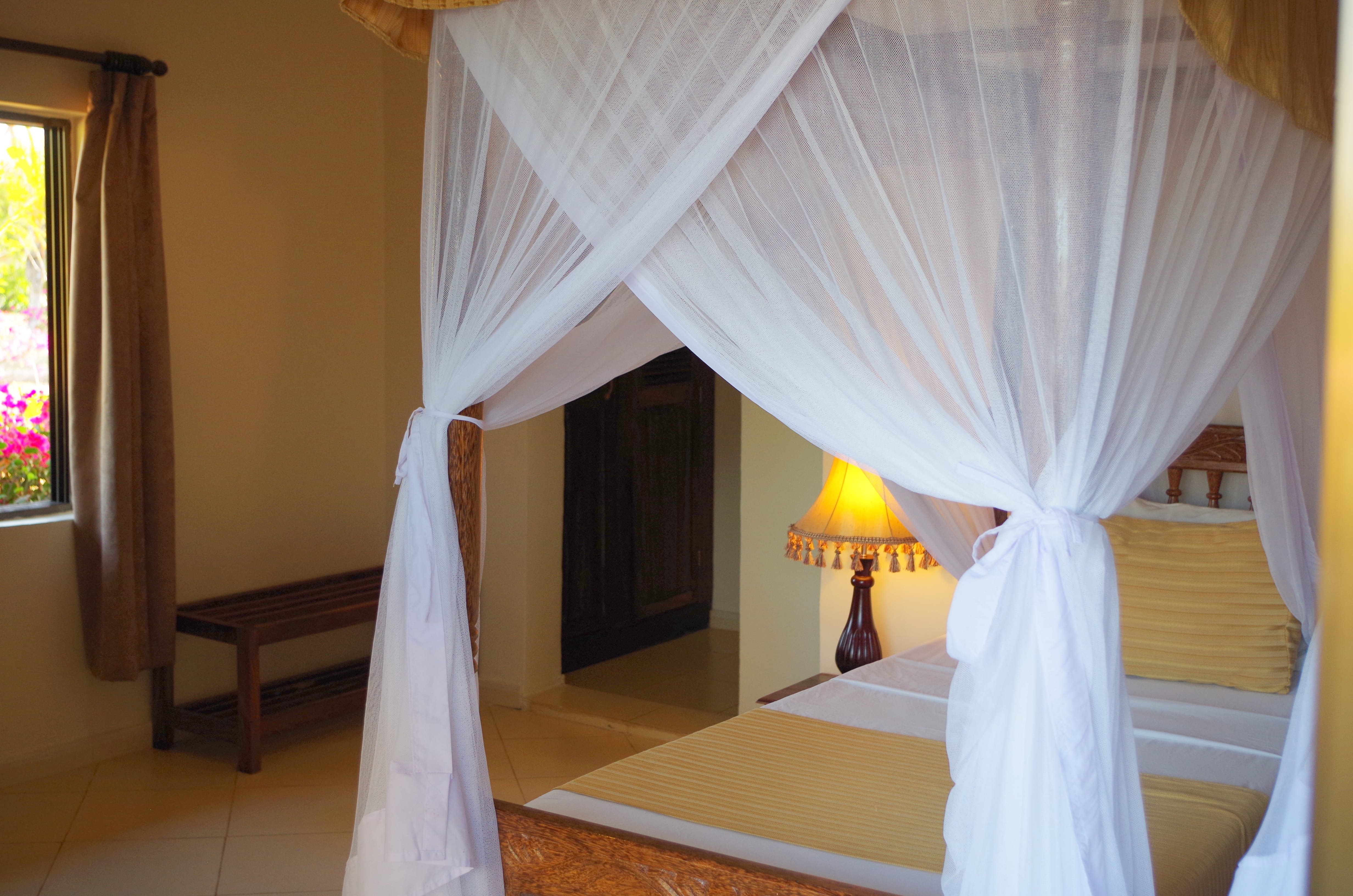 a bed with a white canopy