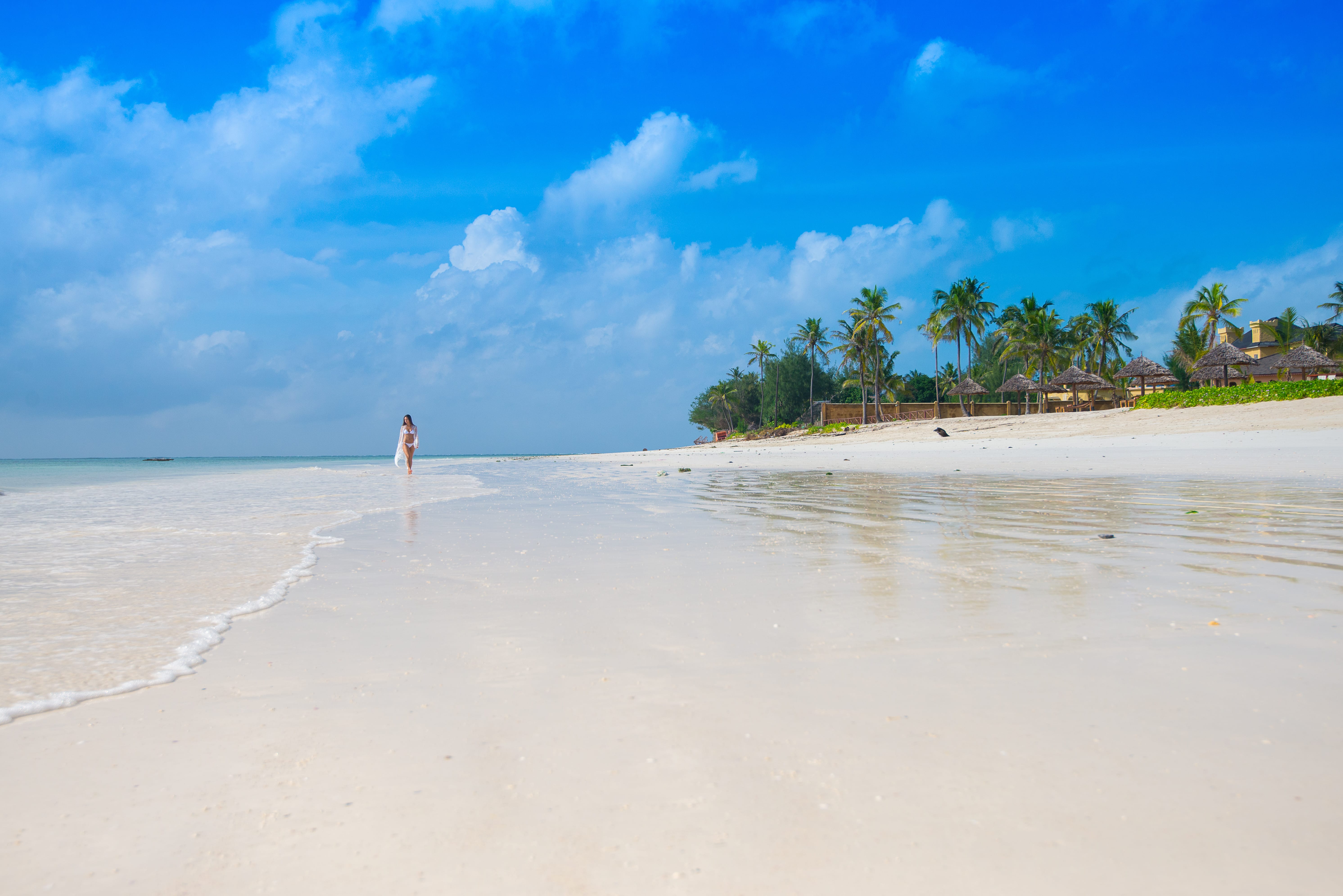 a person walking on a beach