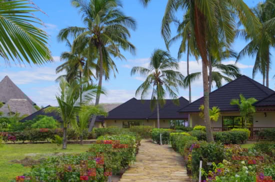 a beautiful garden in front of a house