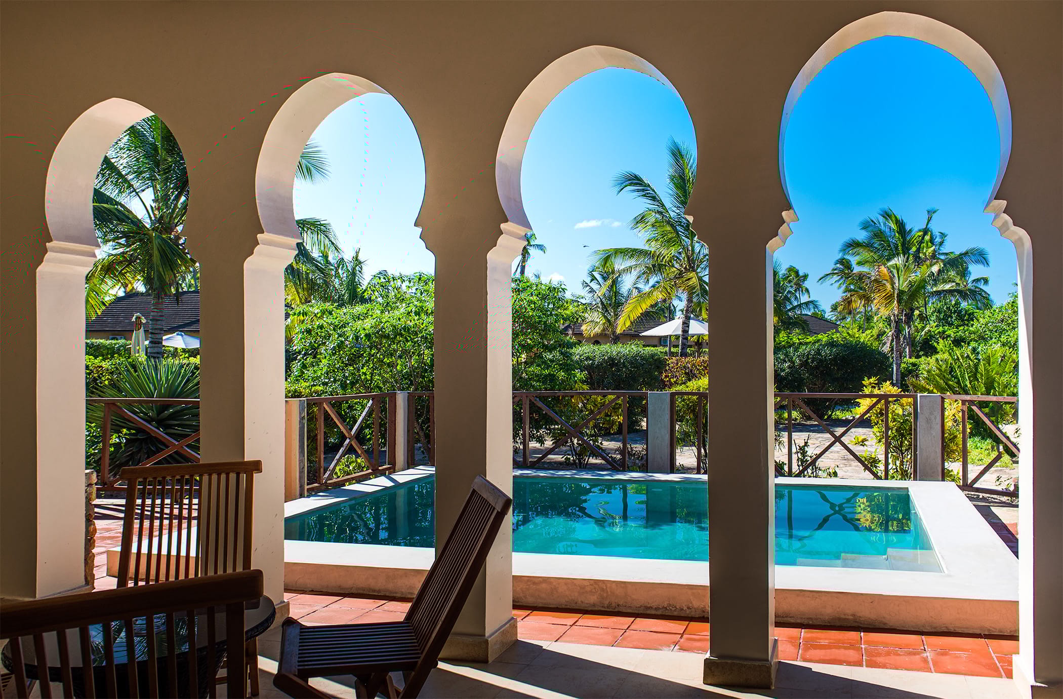 a pool with a large archway