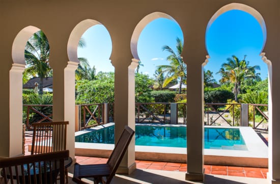 a pool with a large archway