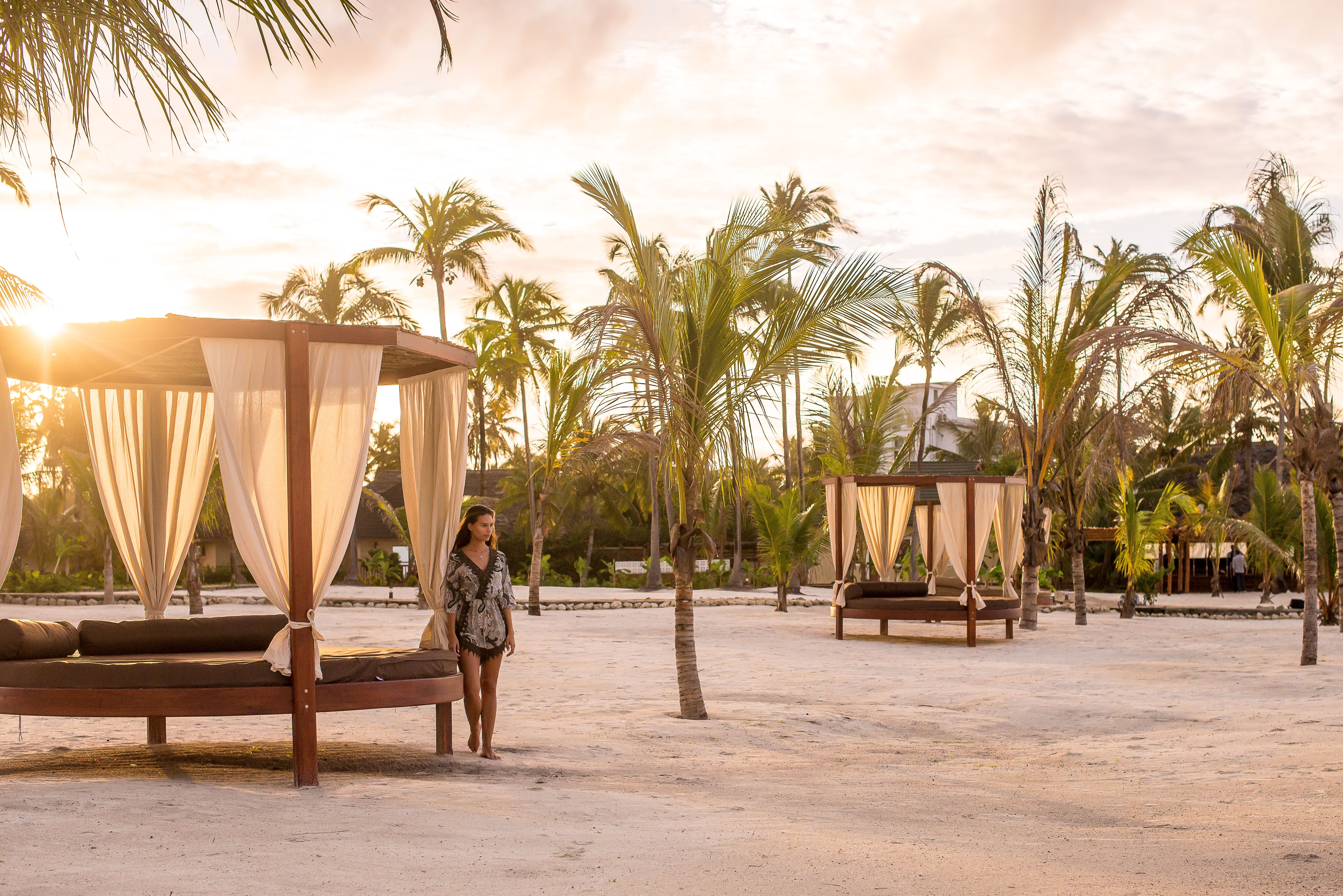 a person standing next to a beach