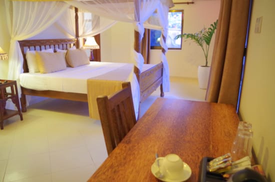 a hotel room with two beds