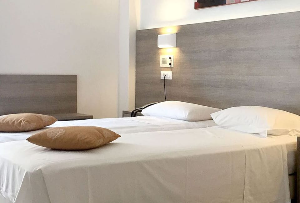 a bed with a white bed spread