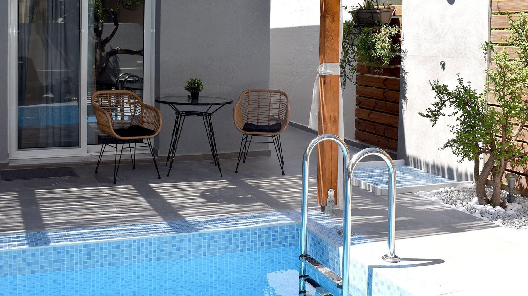 a pool with a table and chairs