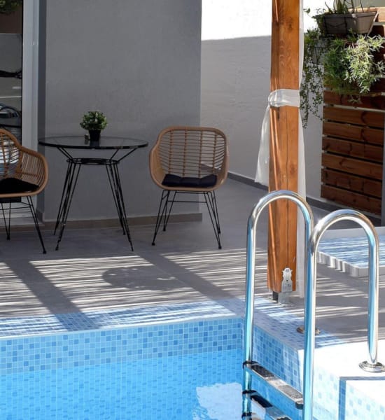 a pool with a table and chairs