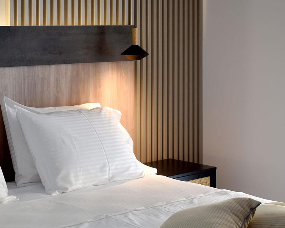 a bed with white pillows