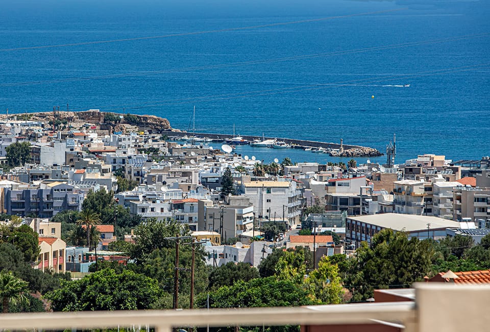 a city with a body of water in the background