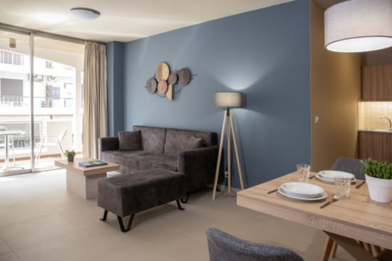 a living room with a couch and a table