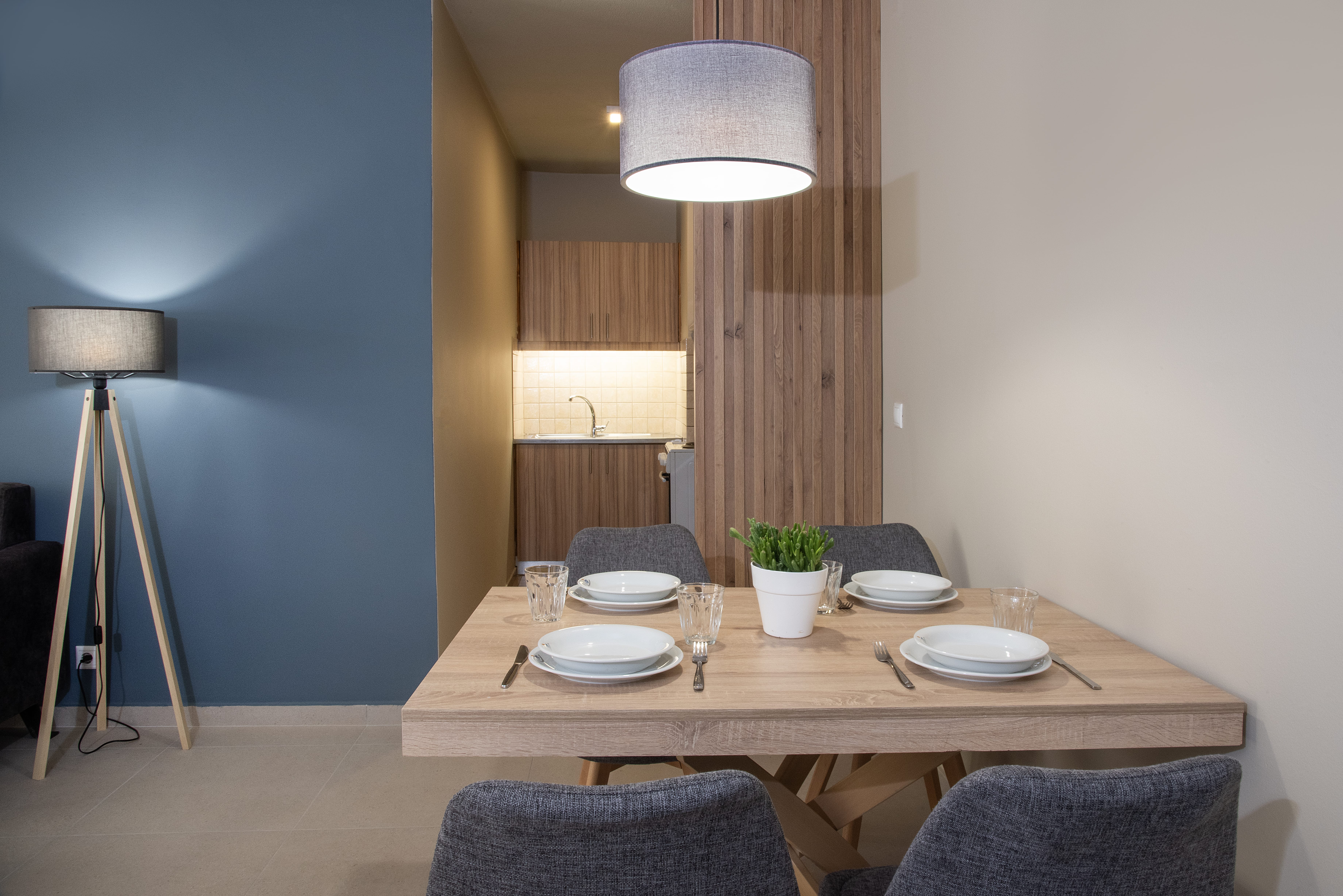 a dining table with plates and glasses