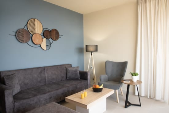 a living room with a couch and a table