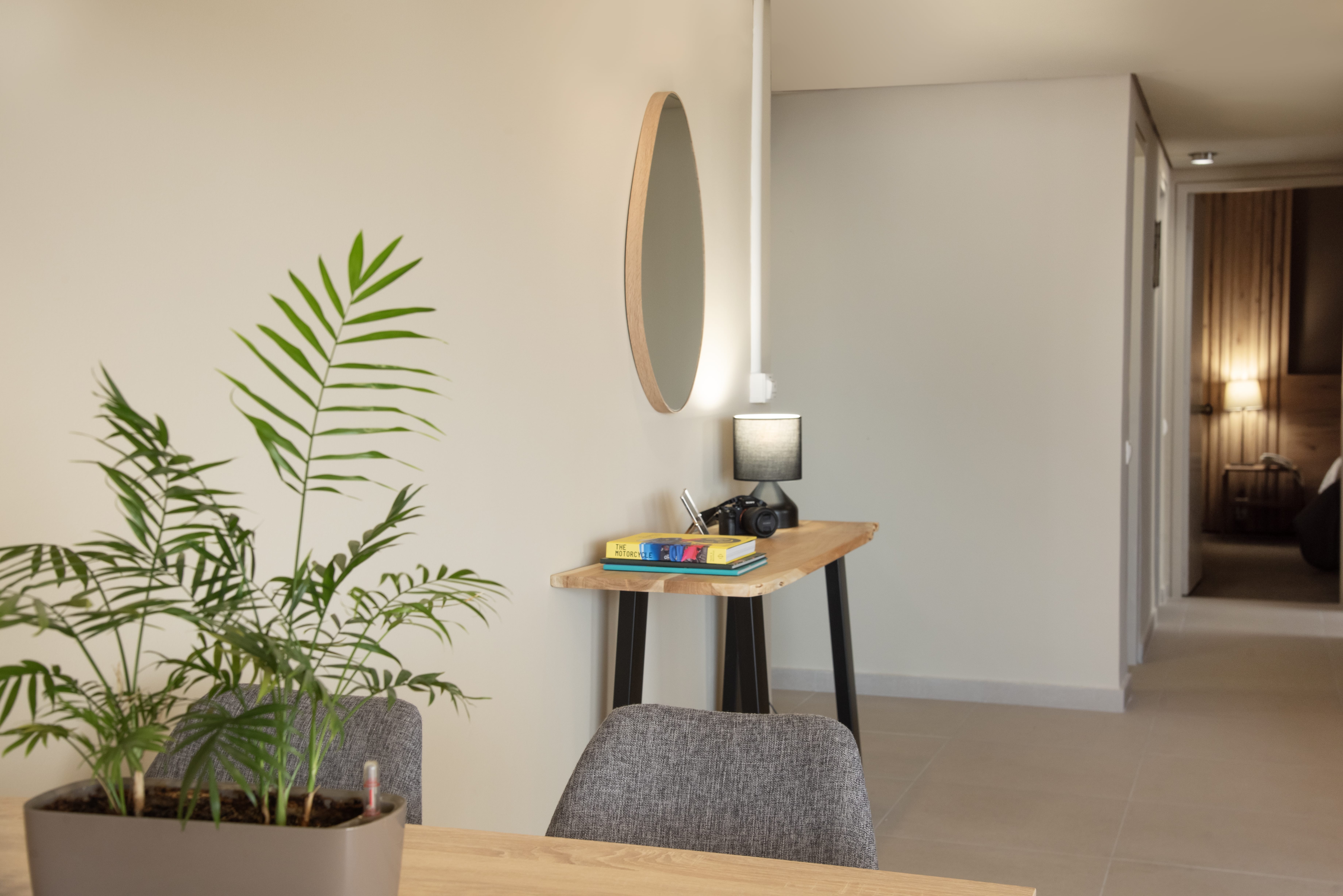 a room with a table and a mirror