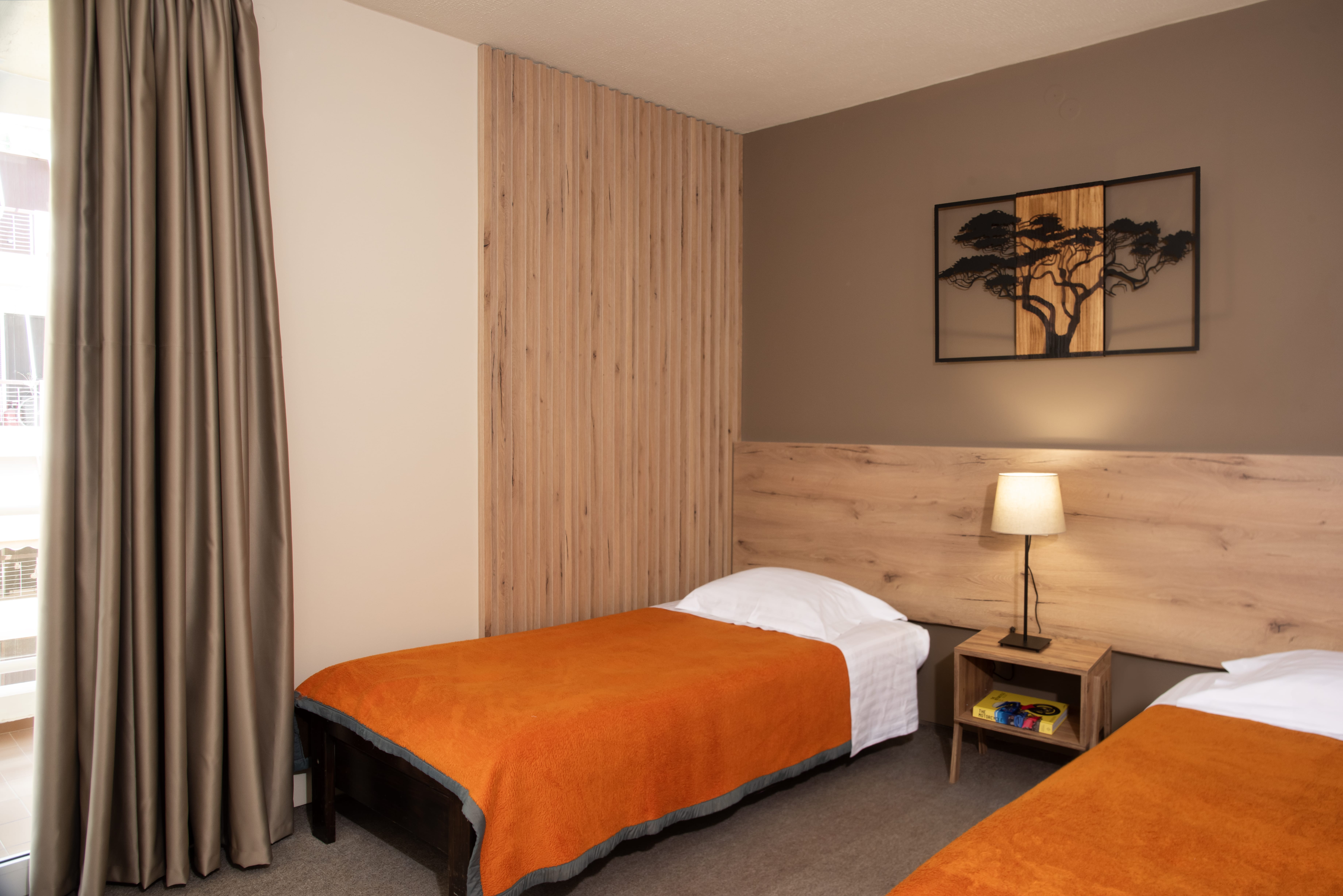 a hotel room with two beds