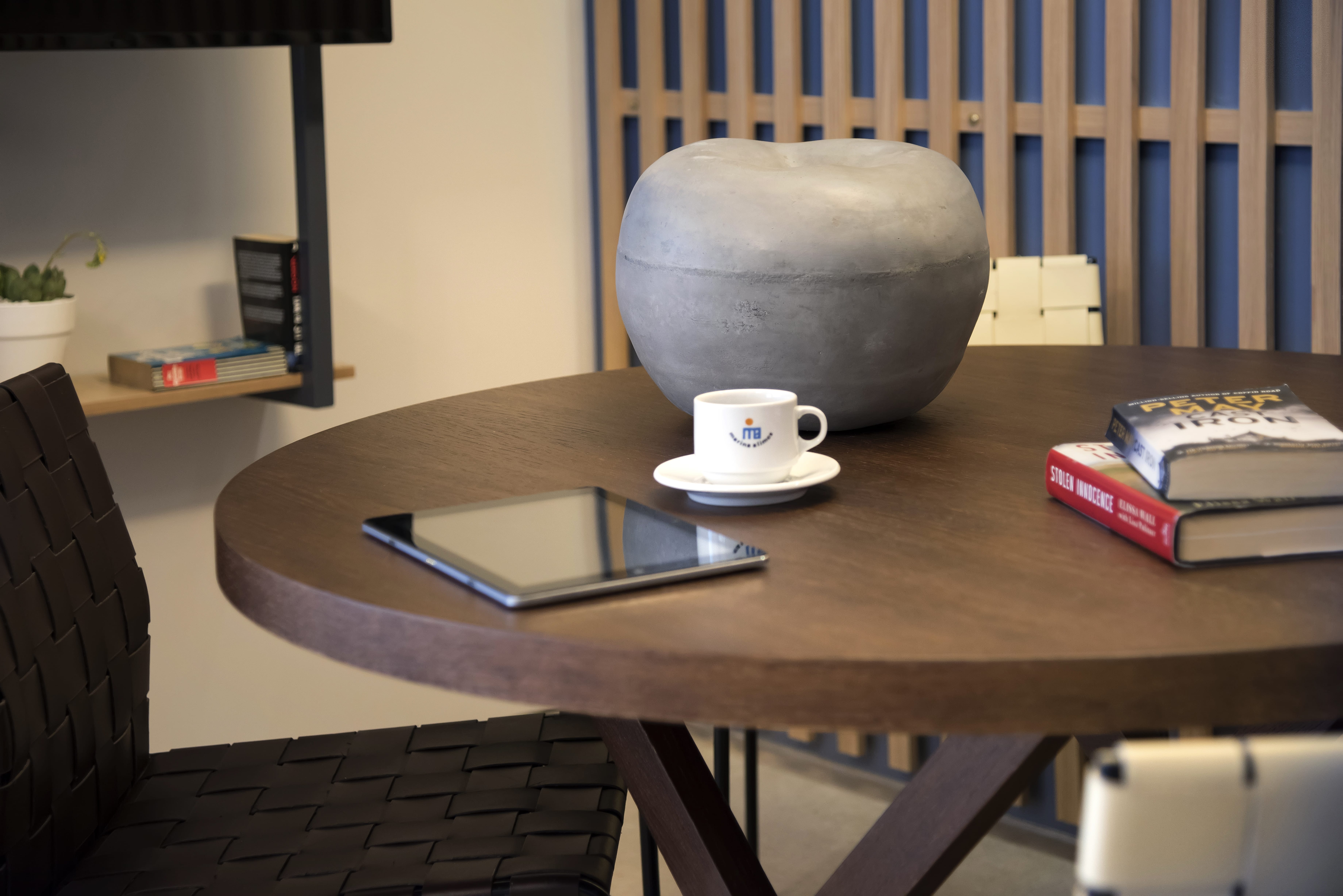a coffee cup and a cell phone on a table
