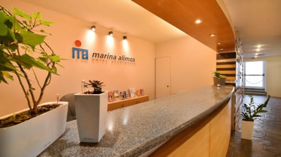 a room with a counter and plants