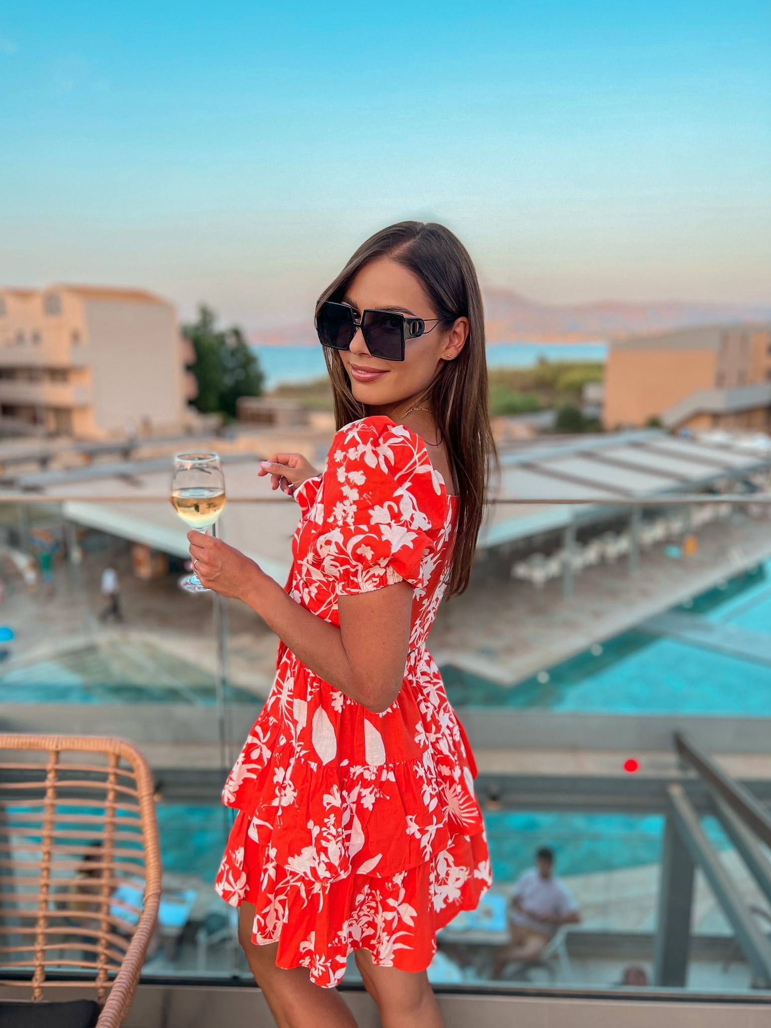 a person holding a glass of wine