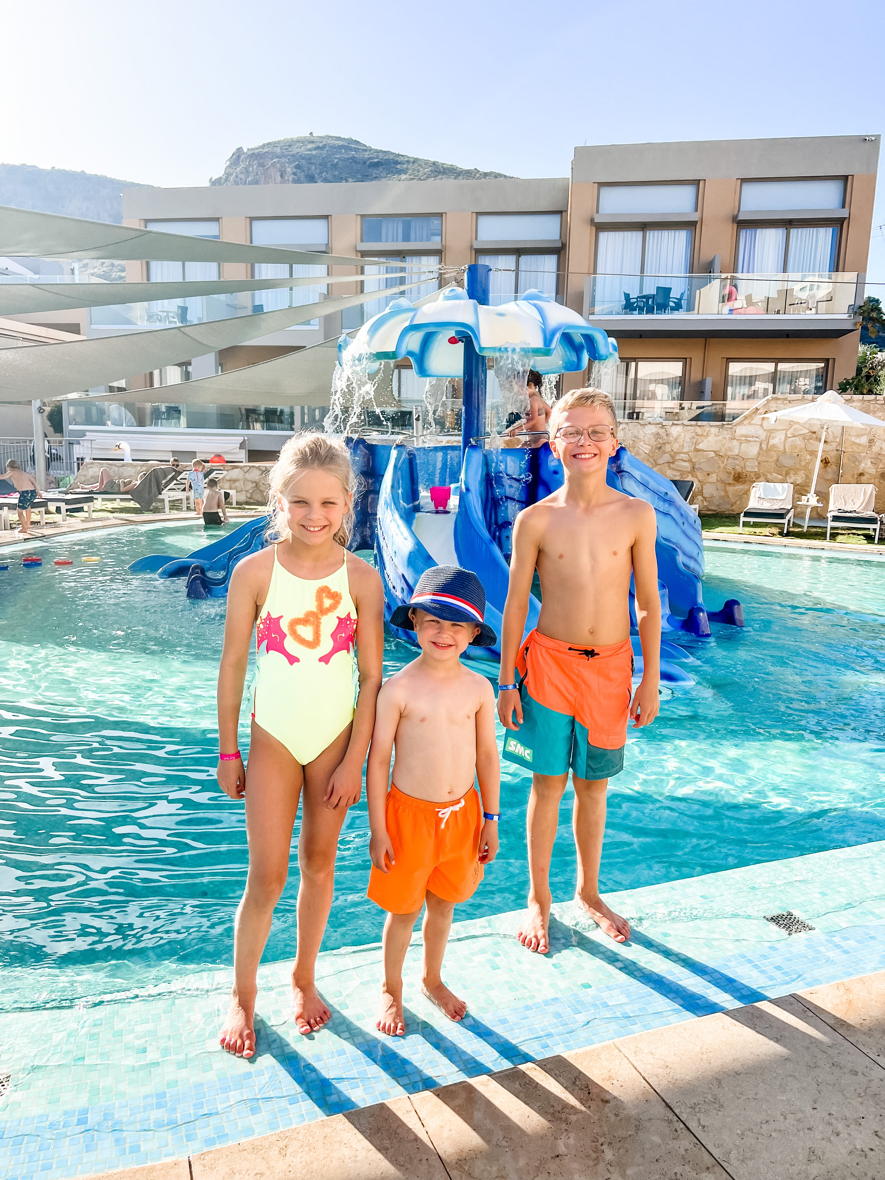 a group of people standing in a pool