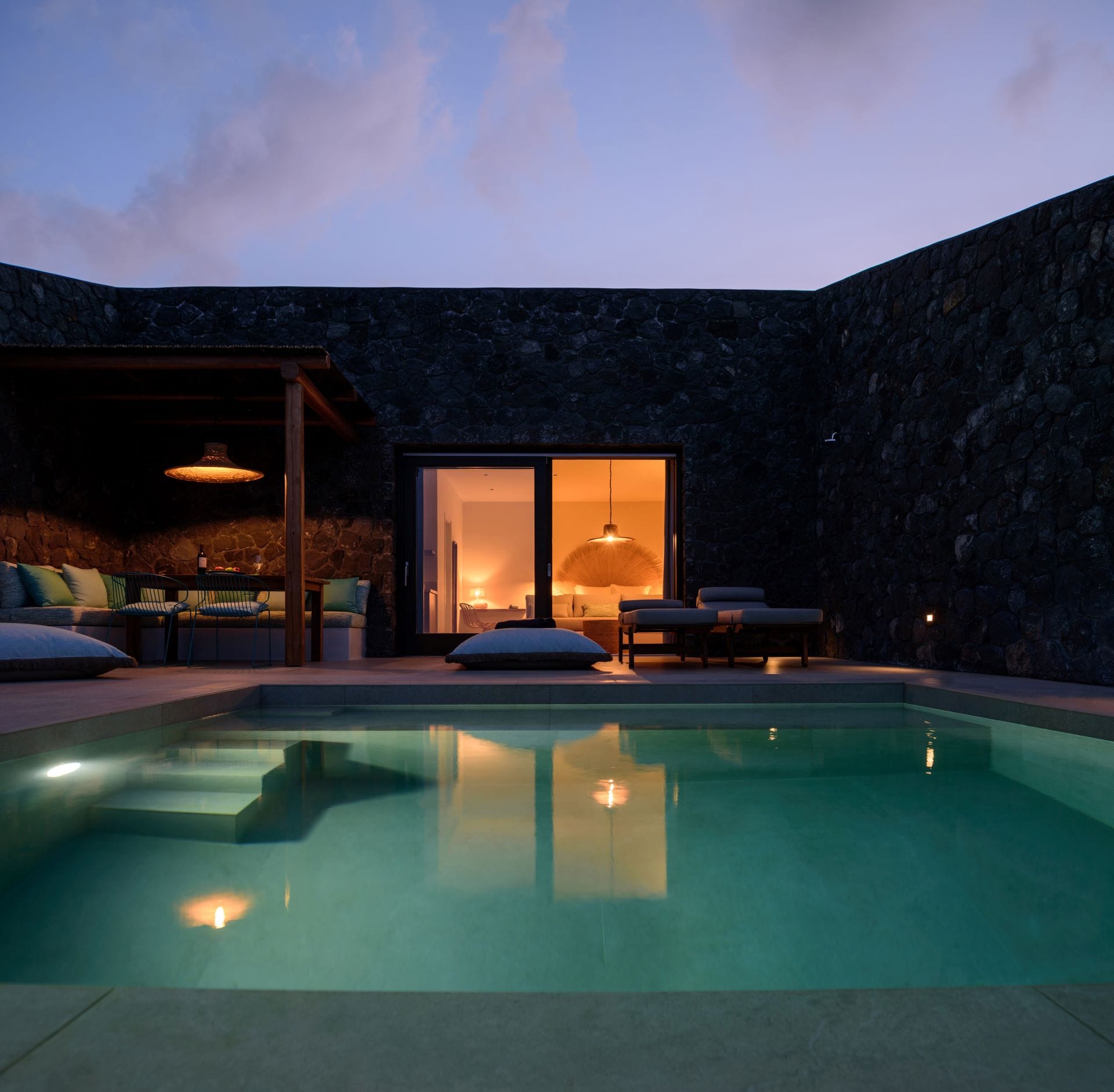 a pool with a house in the background