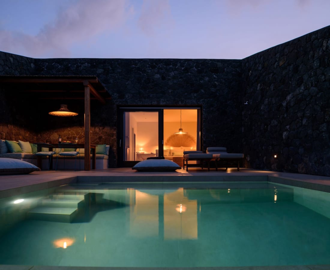 a pool with a house in the background