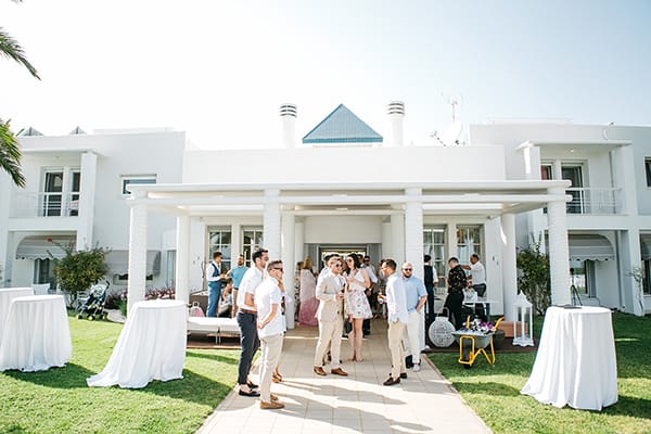a group of people standing outside a house