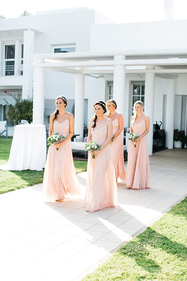 a group of women in dresses