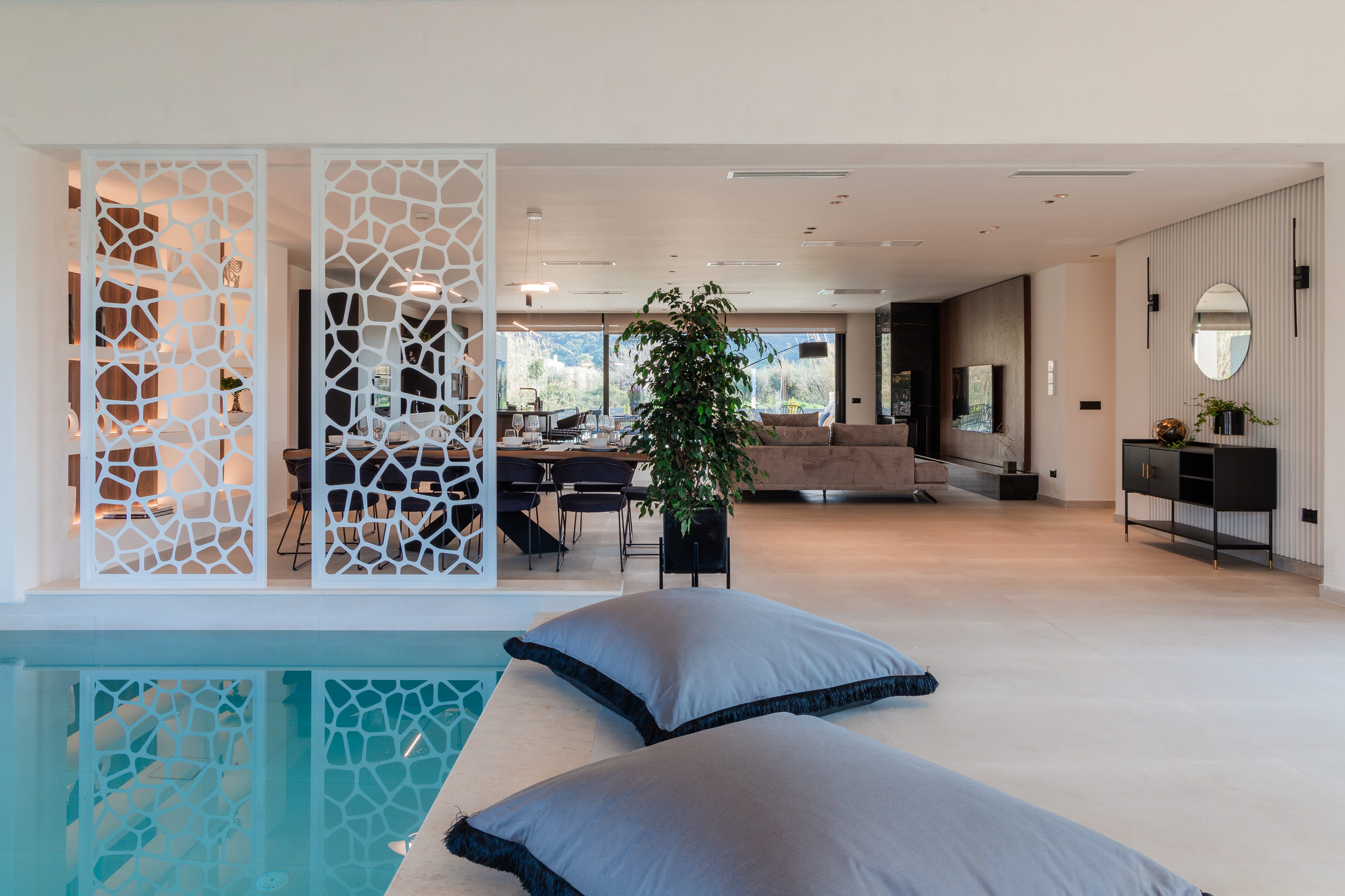 a large room with a large glass wall and a large bed