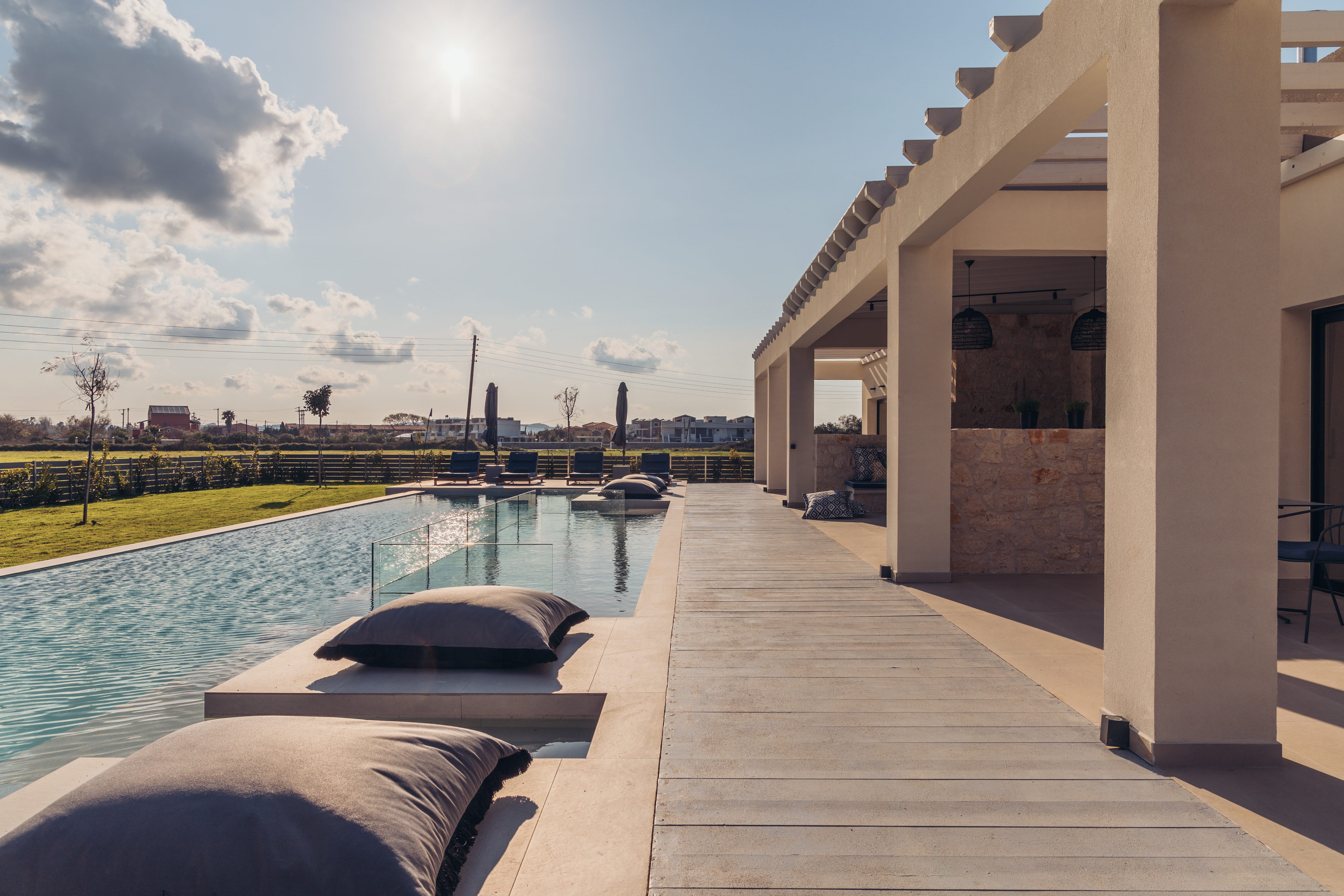 a building with a pool and boats