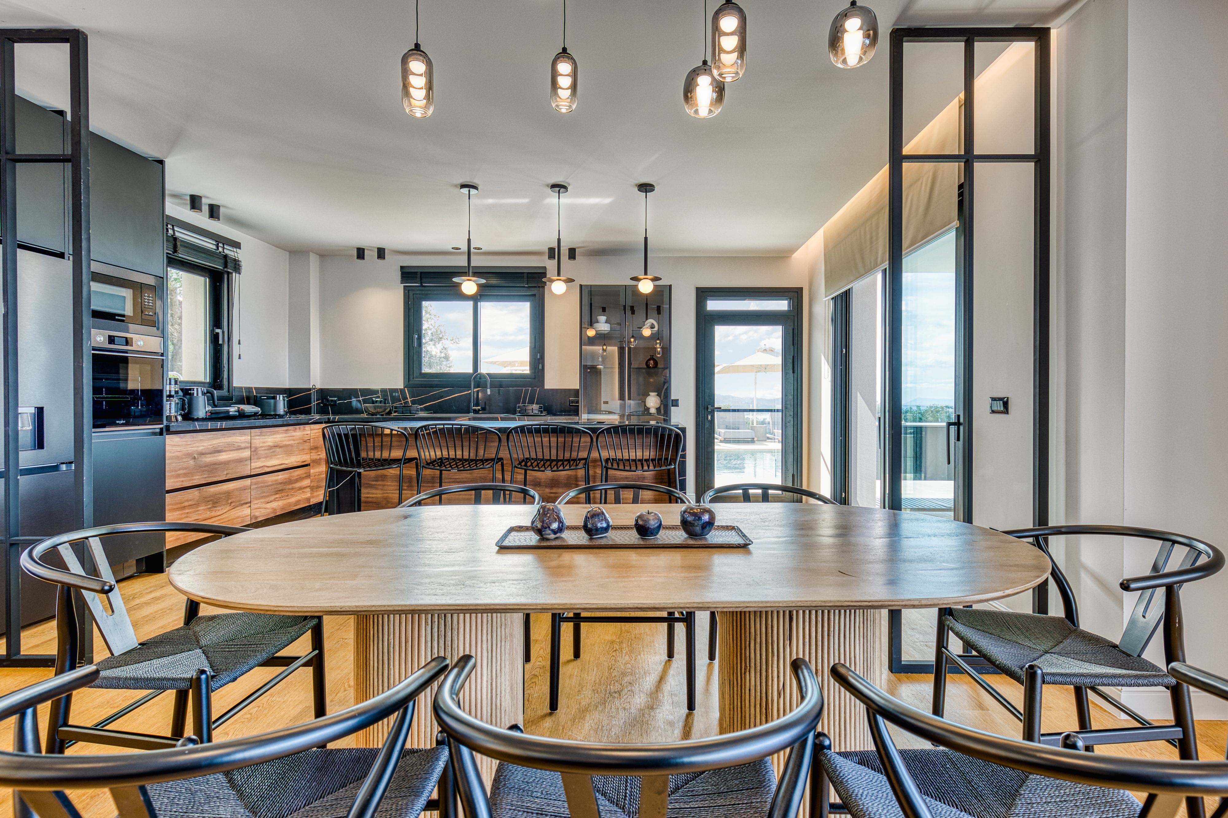 a kitchen with a table and chairs
