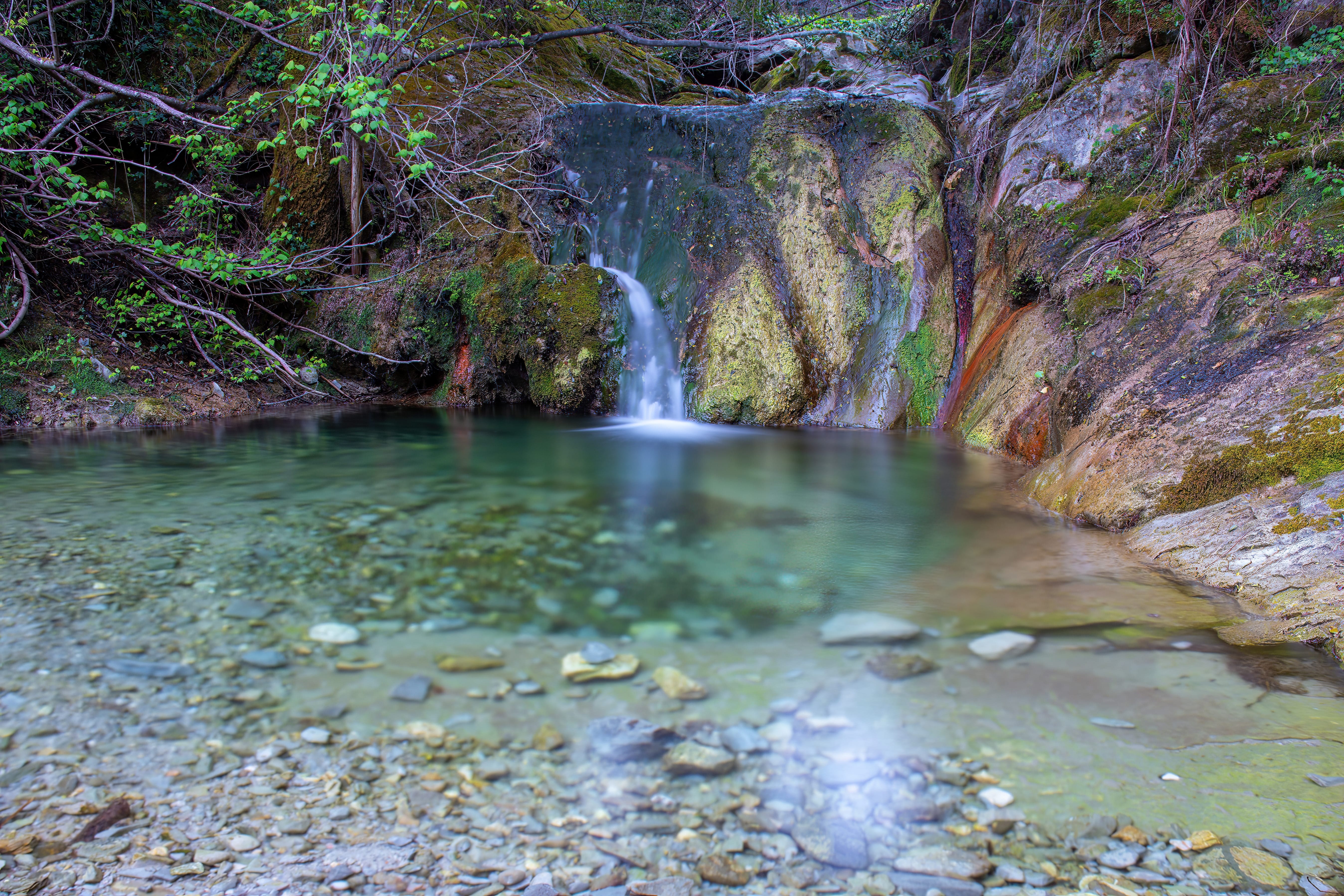 a small waterfall in a rocky area