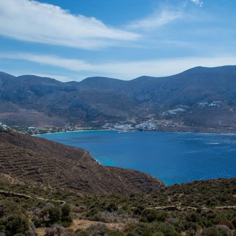 a body of water surrounded by hills