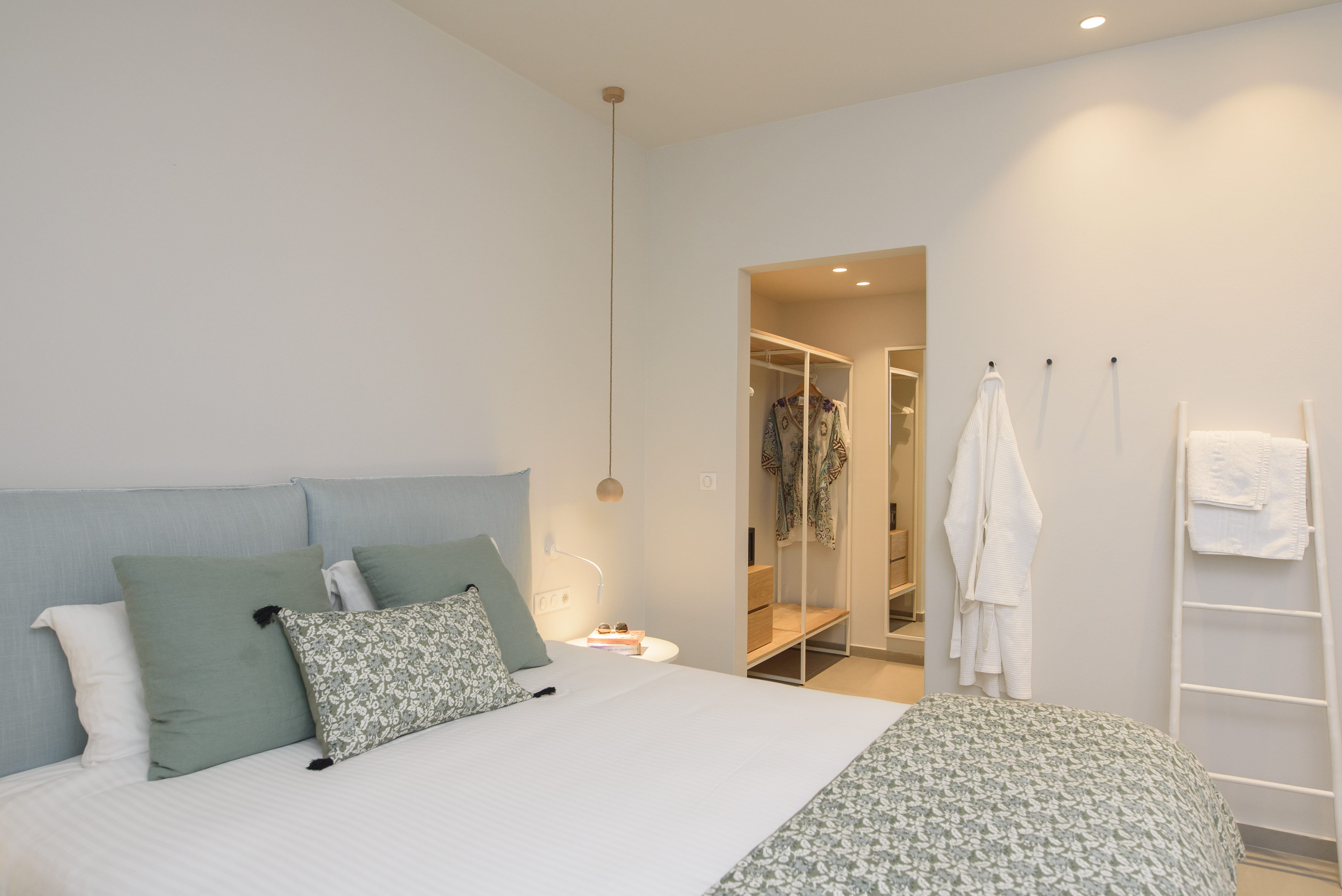 a bedroom with a bed and a closet