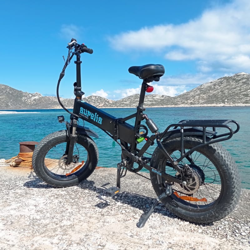 a bicycle parked on a beach