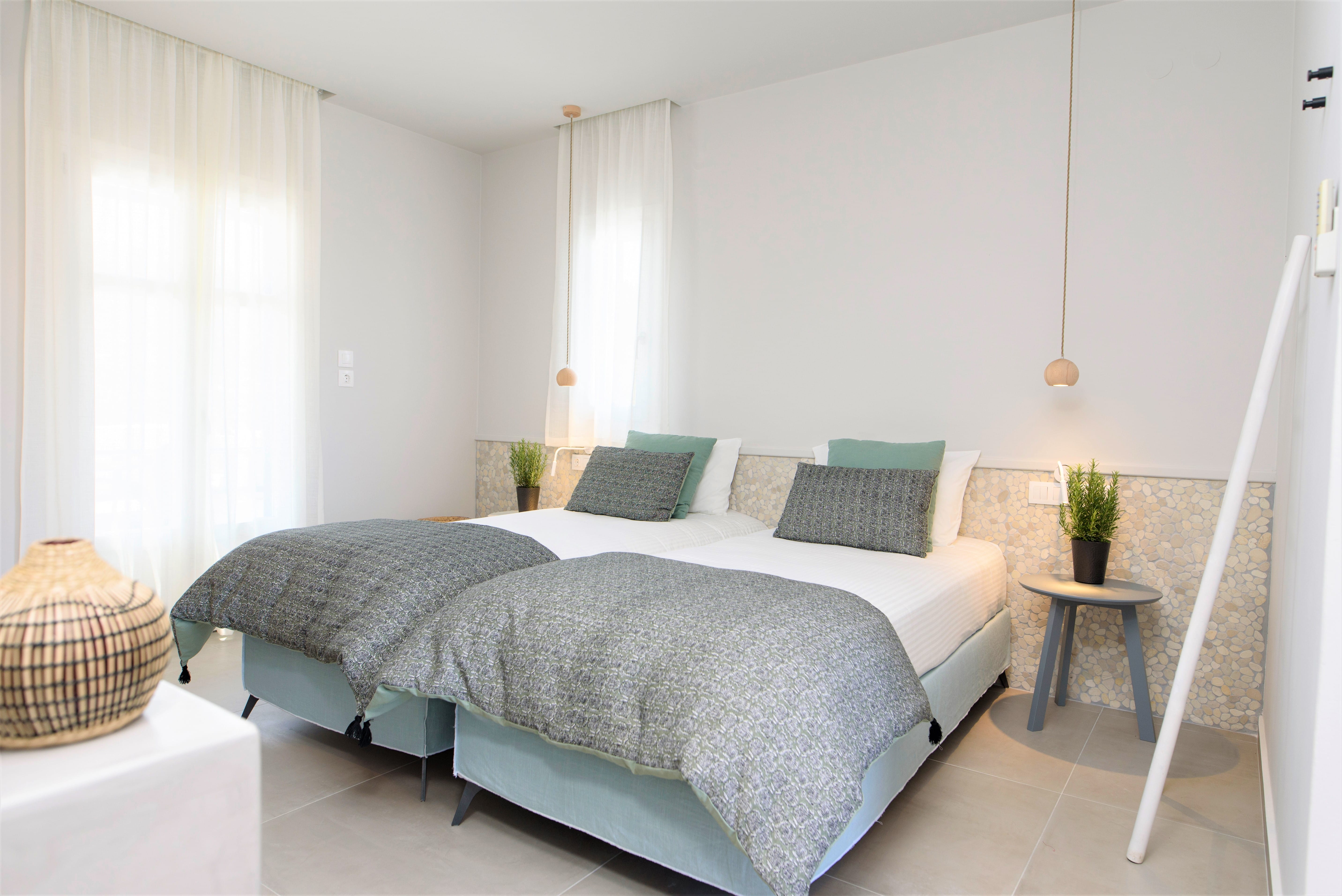 a bed with a white bed spread