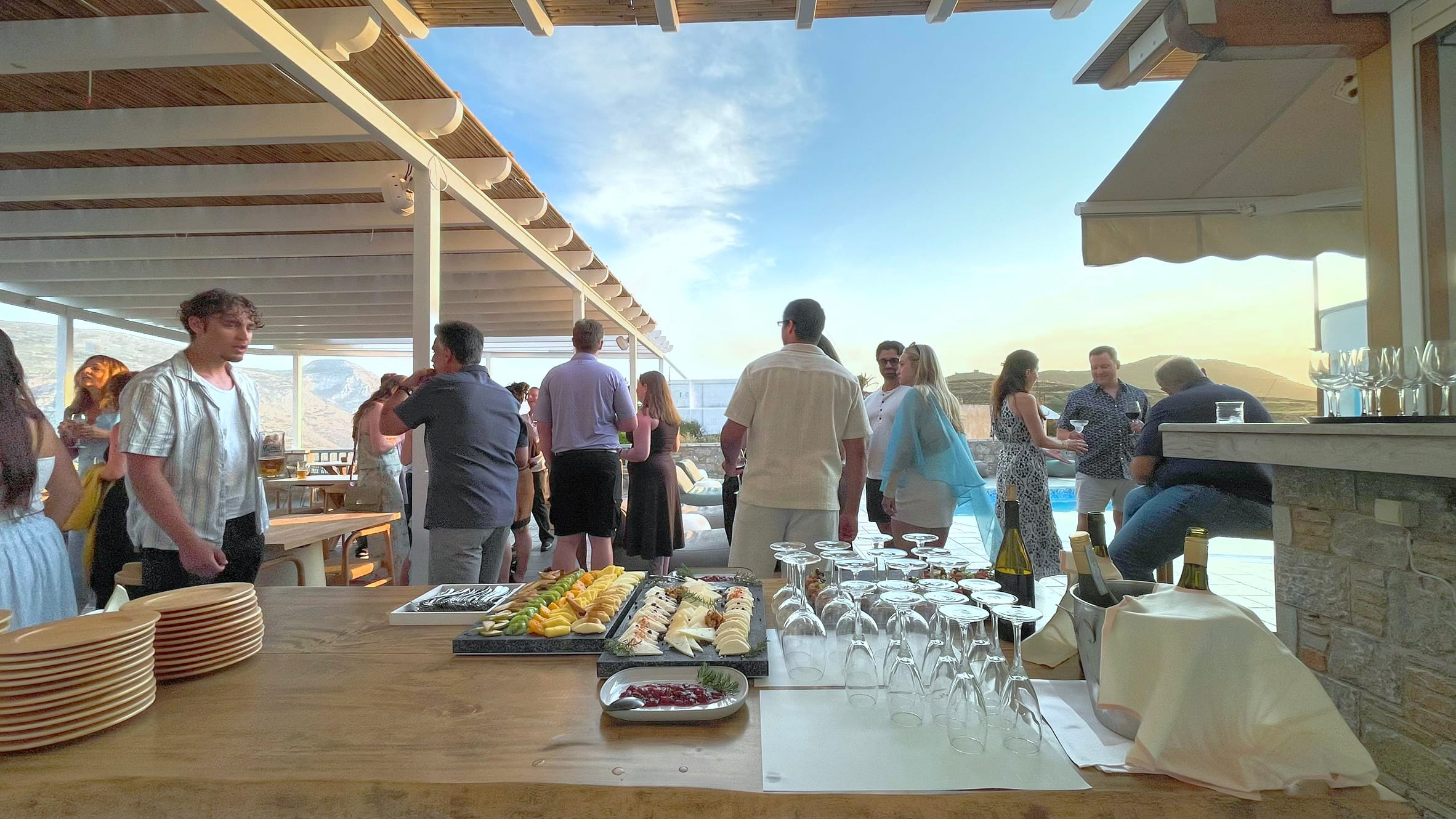 a group of people standing around a table