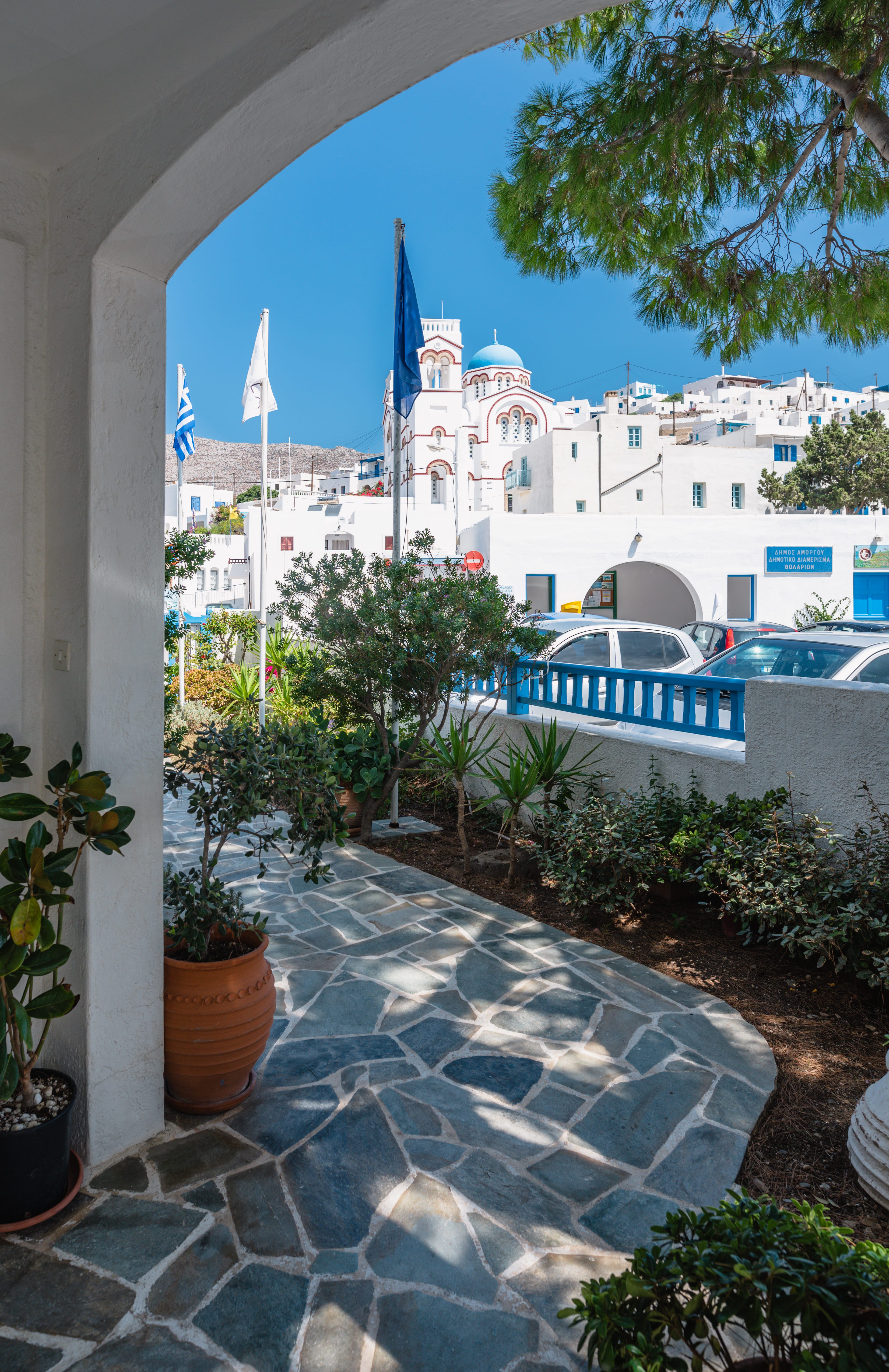a stone walkway with a building in the background