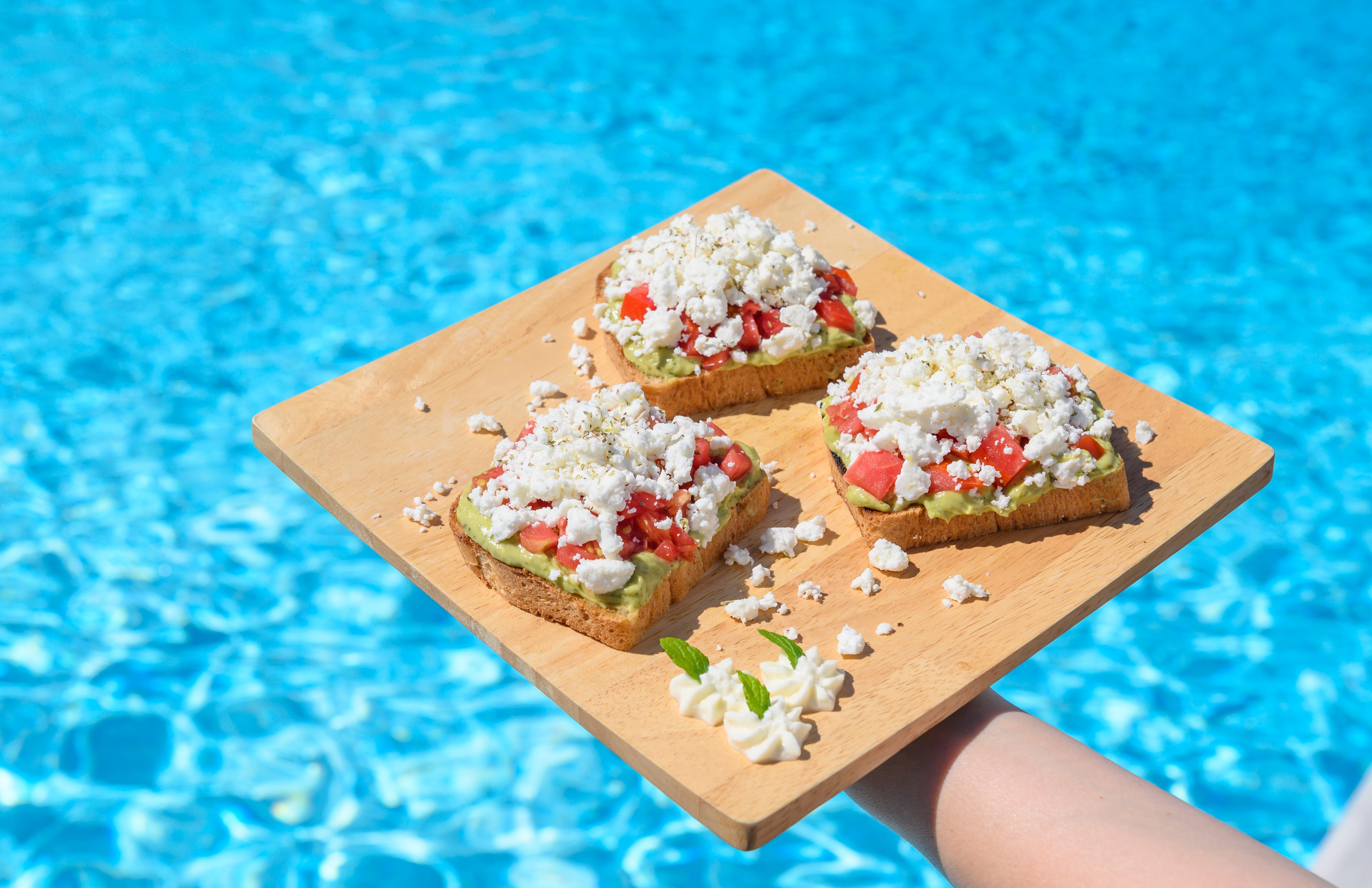 a wooden board with food on it