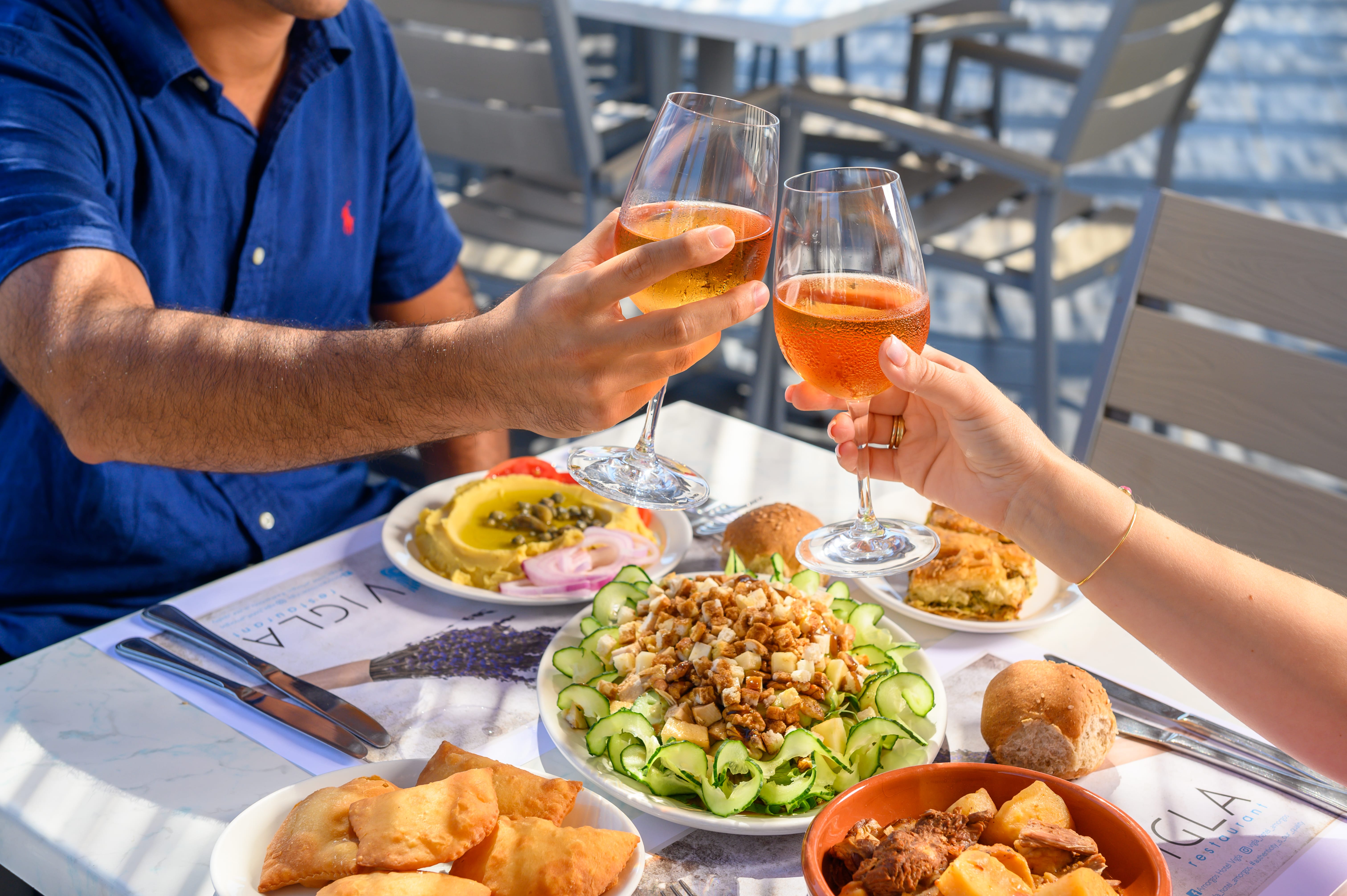 a person holding a glass of beer