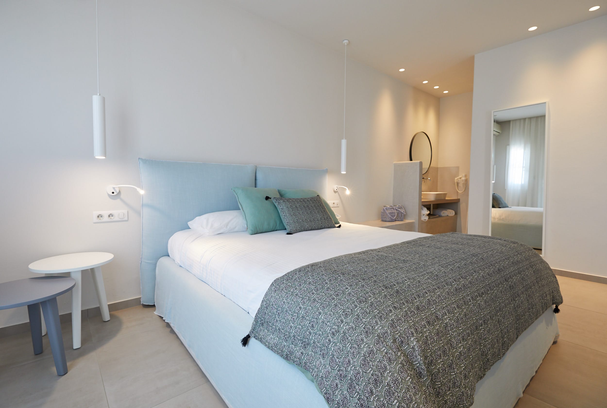 a hotel room with a bed and a desk