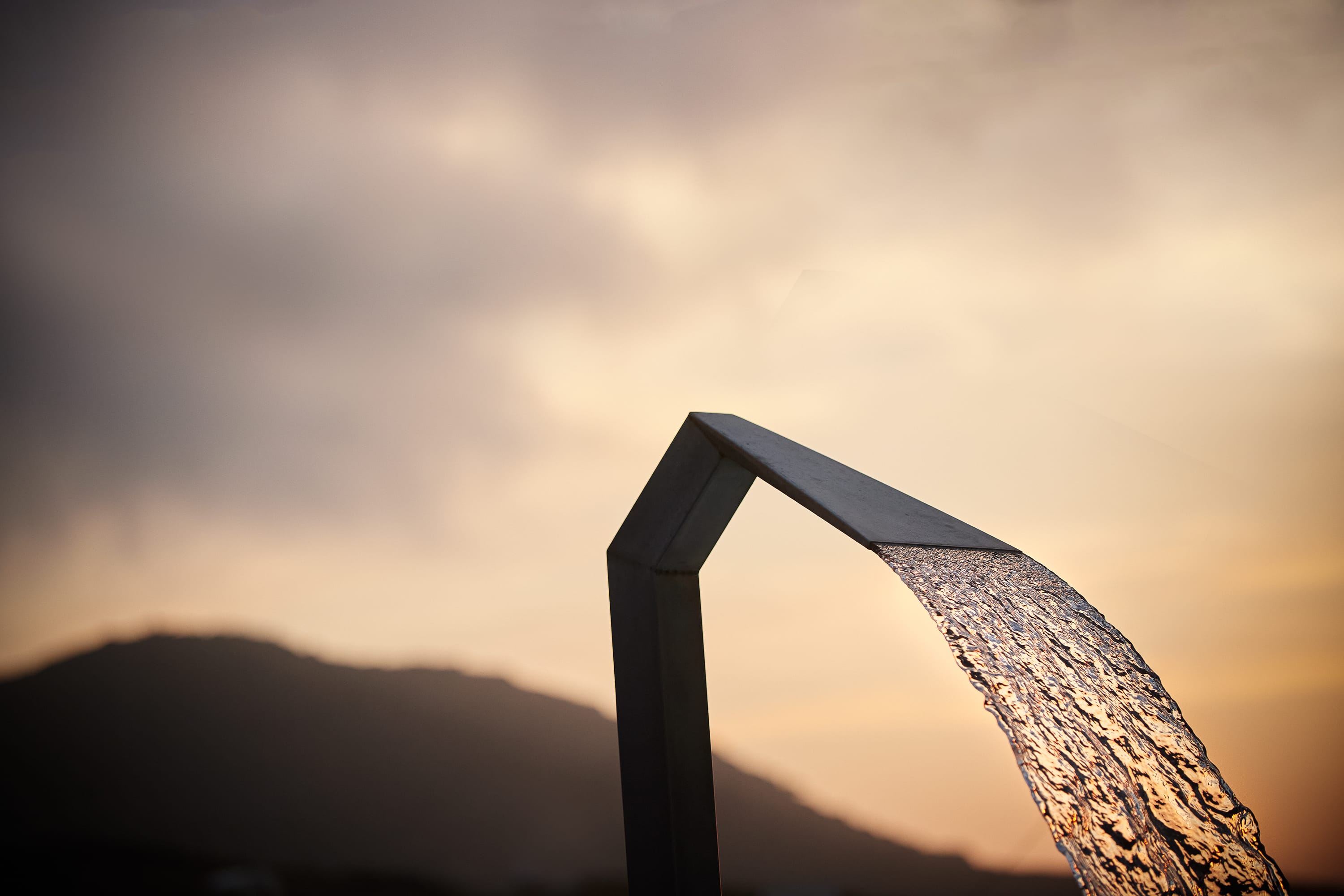a water pouring out of a pipe