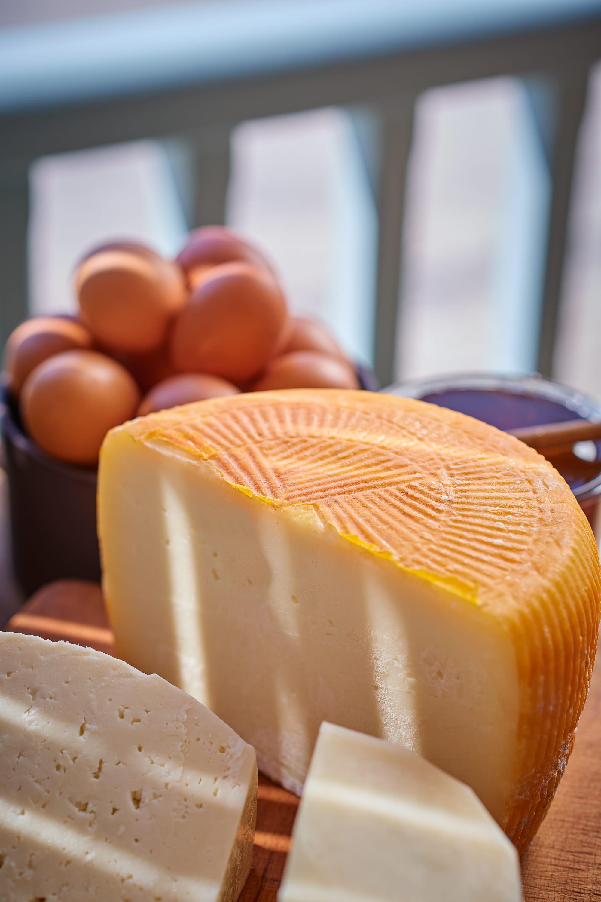 a cheese and eggs on a table