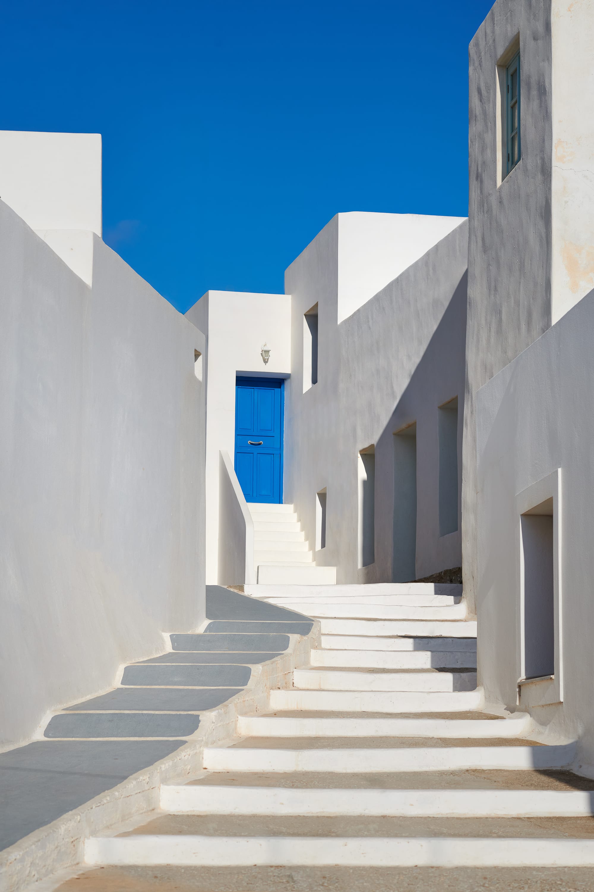 a white building with blue door