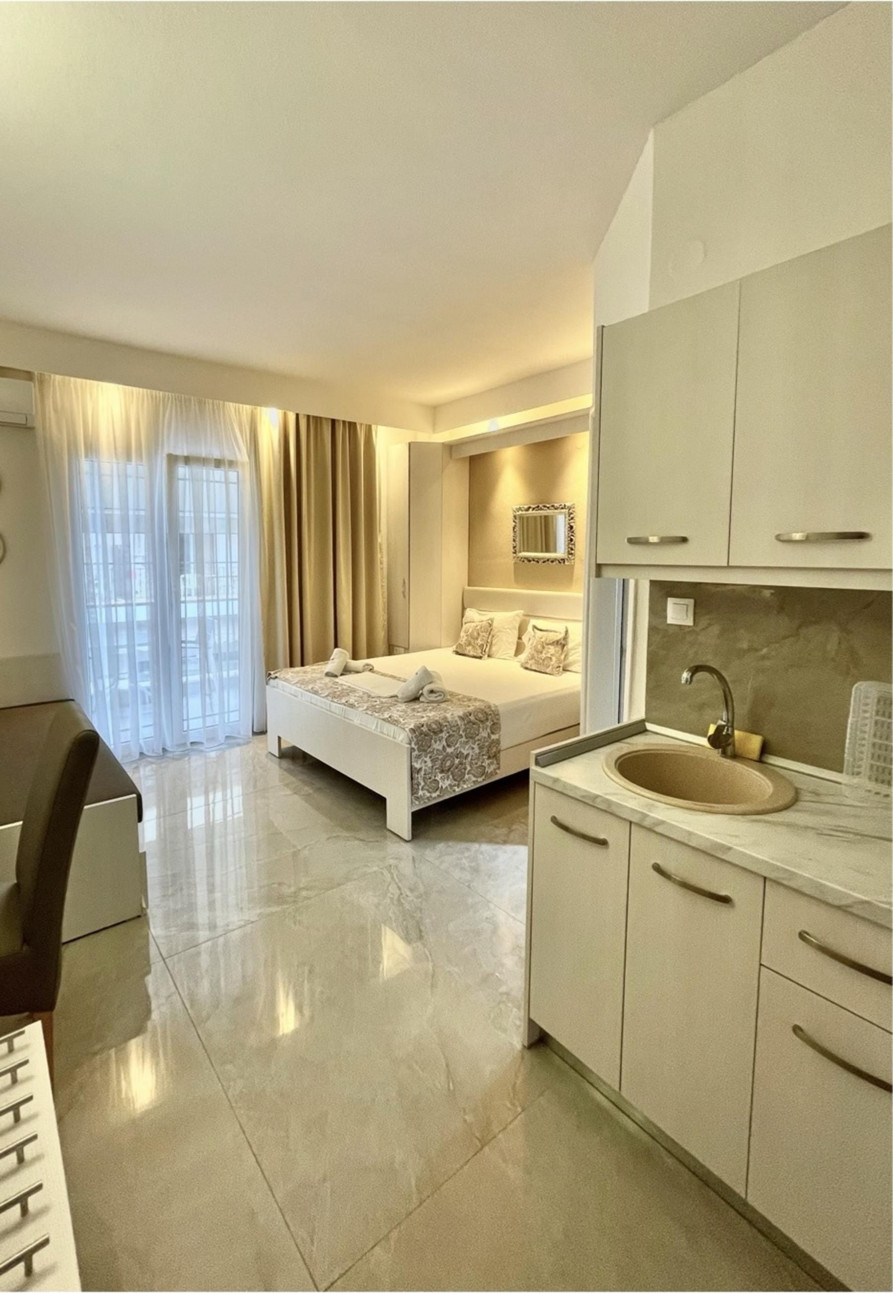 a bathroom with a bed sink and a bed