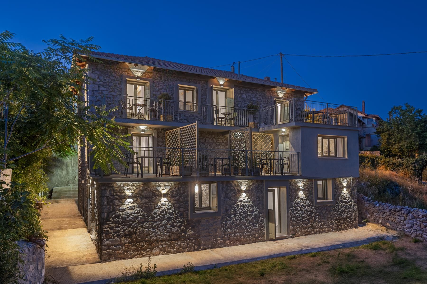 a house with a stone wall