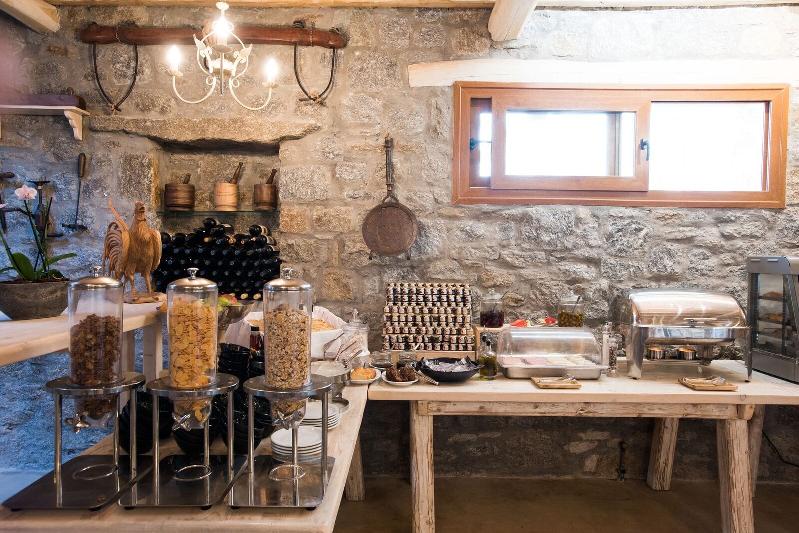 a kitchen with a stone wall