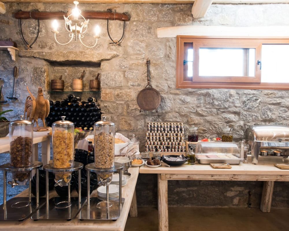 a kitchen with a stone wall