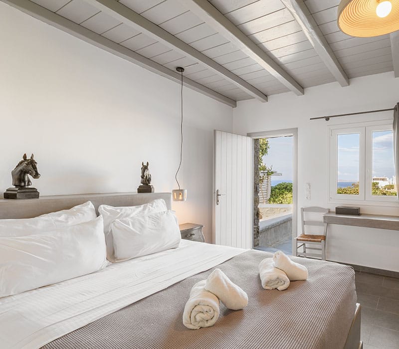 a bed with white sheets