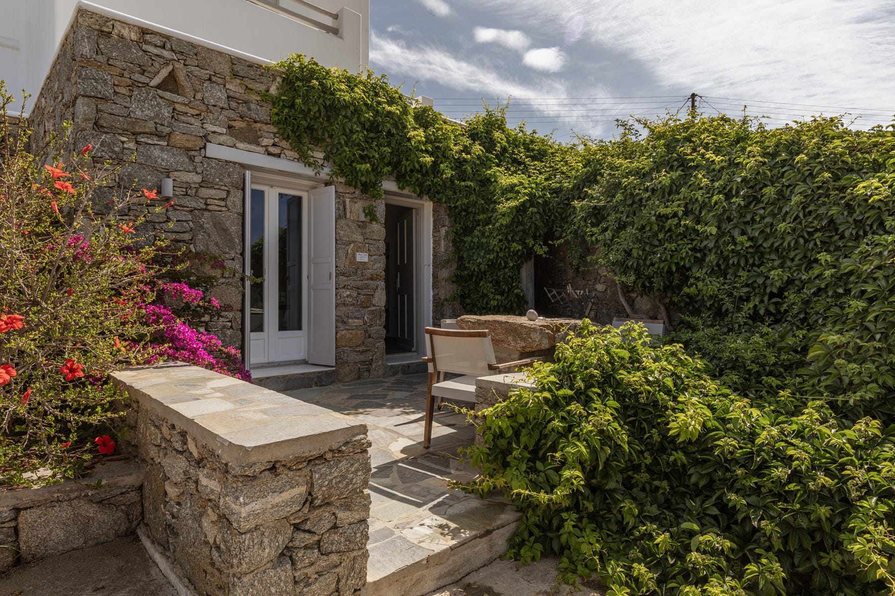 a stone house with a stone patio