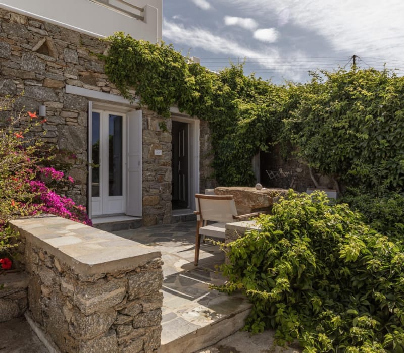 a stone house with a stone patio