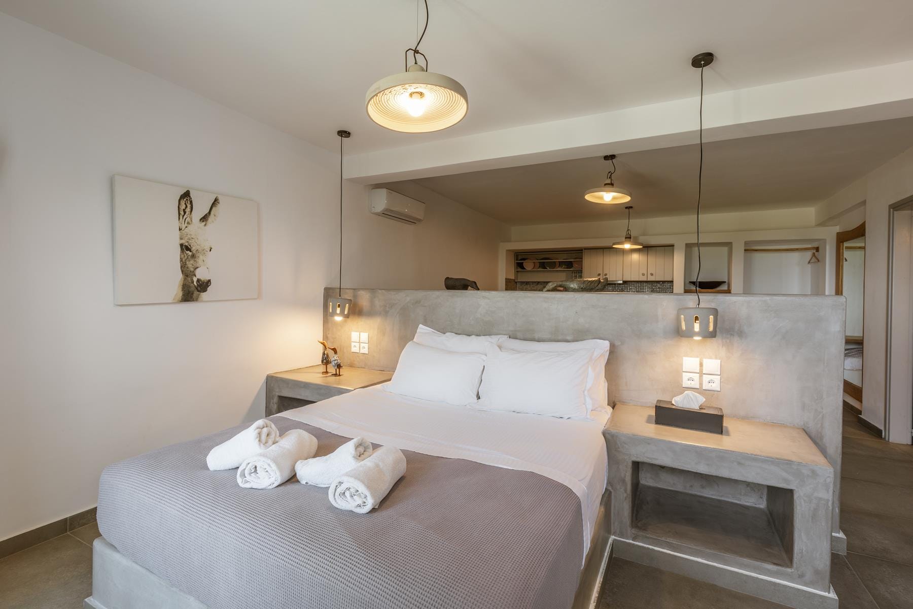 a large bed with white sheets